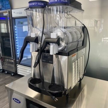 Front right view countertop frozen beverage slush machine with 2 clear dispensers