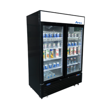 Angled view of a commercial freezer with 2 closed doors and beverage containers spaced out on the shelves inside