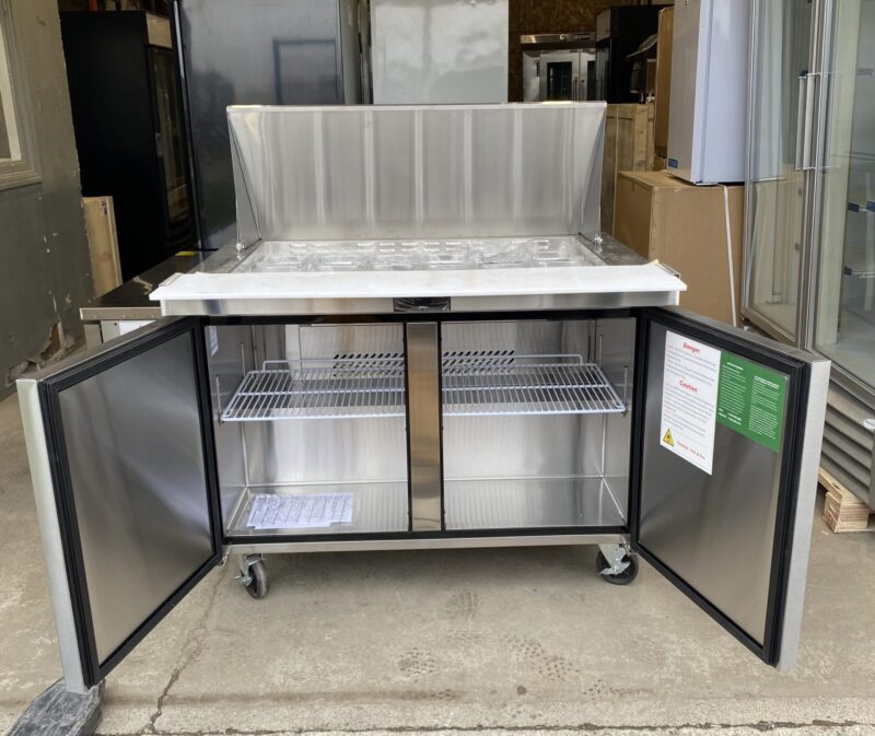 Full view of sandwich preparation table cooler both cooler doors and lid open