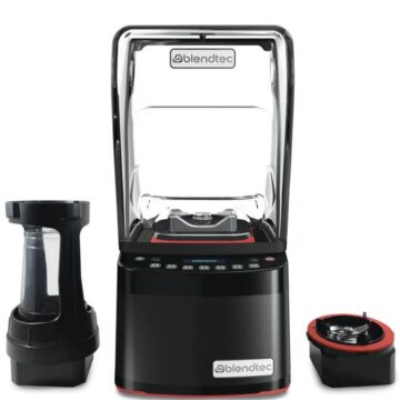 Front view black blendtec blender with parts on the side
