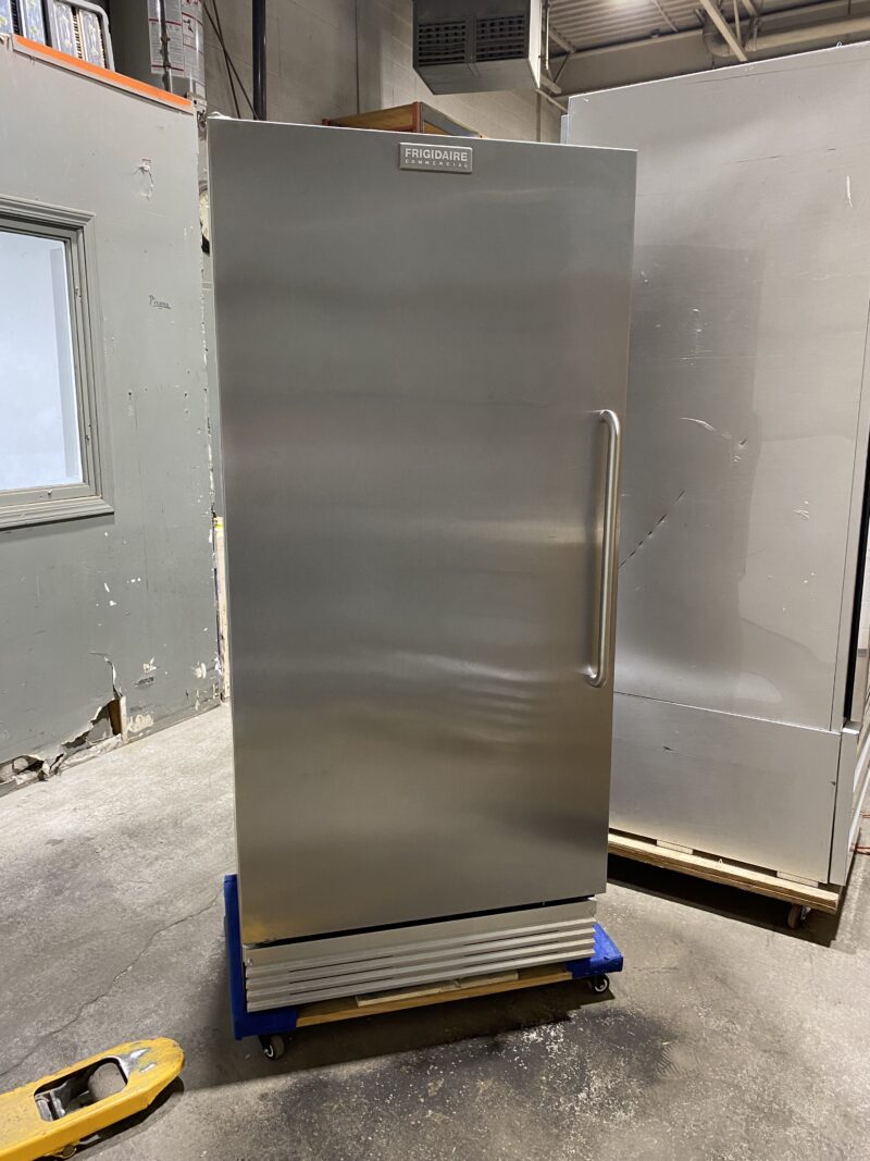 Front view of stainless steel upright commercial 1 door freezer door handle on left side