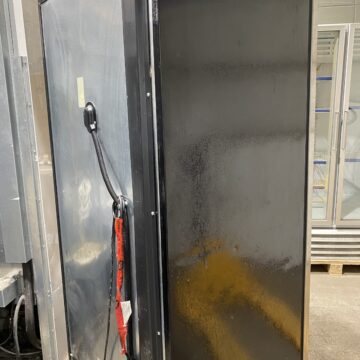 Back side view of upright freezer showing plugs