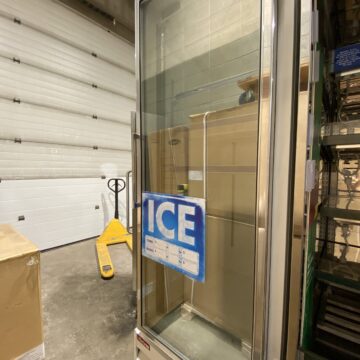Upright glass door freezer with ice sticker