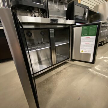 Front side view of open doored under counter fridge with 1 shelf