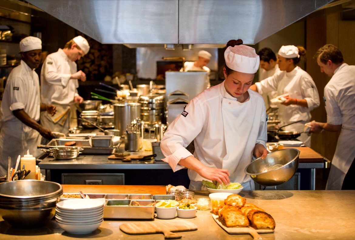 chefs in kitchen preparing meals