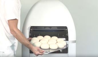 dough bun rounding machine putting buns inside