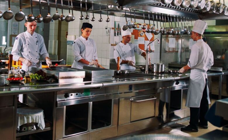 chefs cooking in kitchen