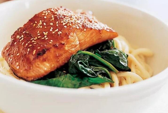 salmon with noodles and greens