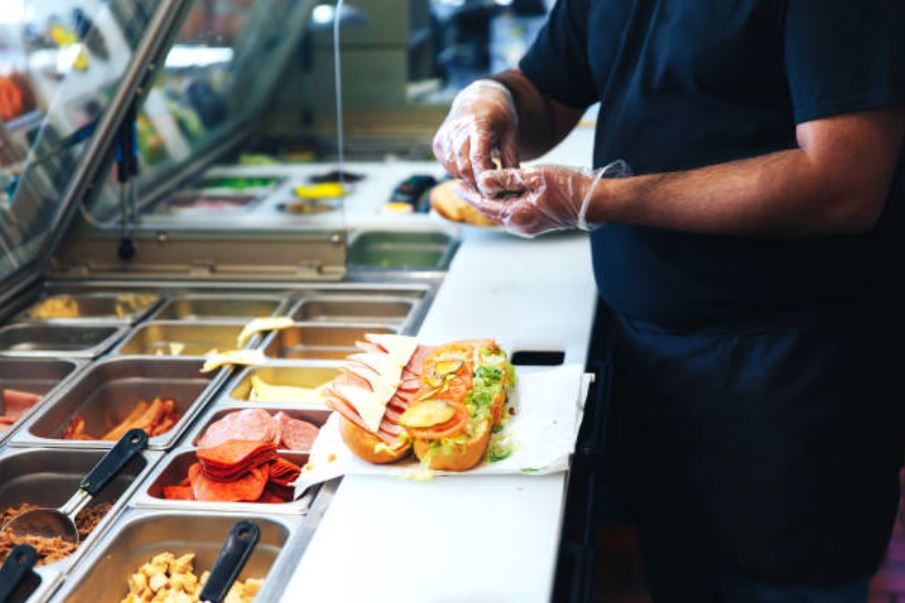 preparing a sandwich and a sandwich bar